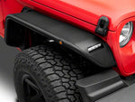 a close cropped image of a jeep wrangler with a tubular fender flare installed