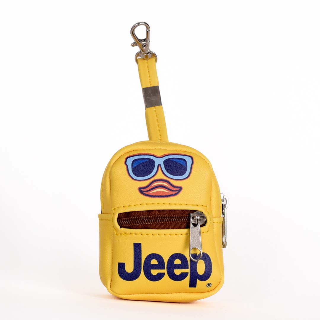 a tiny backpack shaped keychain with the jeep logo and a duck face with sunglasses