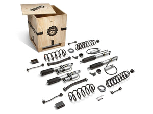 a wooden jeep labeled box sitting behind all the pieces of the lift kit