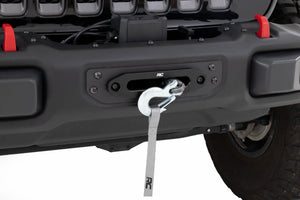 an installed winch plate in the rear of a jeep with a clip showing