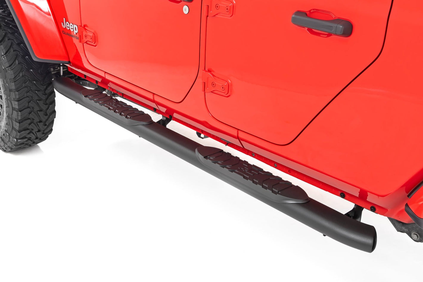 a red jeep with subtle steps installed by doors