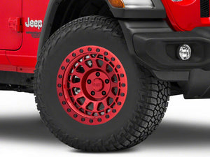 A red jeep wrangler with a black red shiny wheel