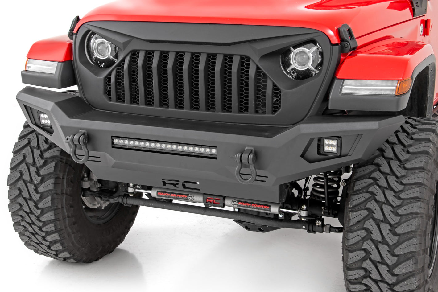 the front of a red jeep with a bumper installed with hooks