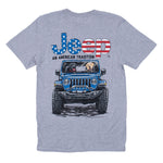 a grey shirt with two dogs driving a blue jeep and the words “jeep an american tradition” with usa flag flair