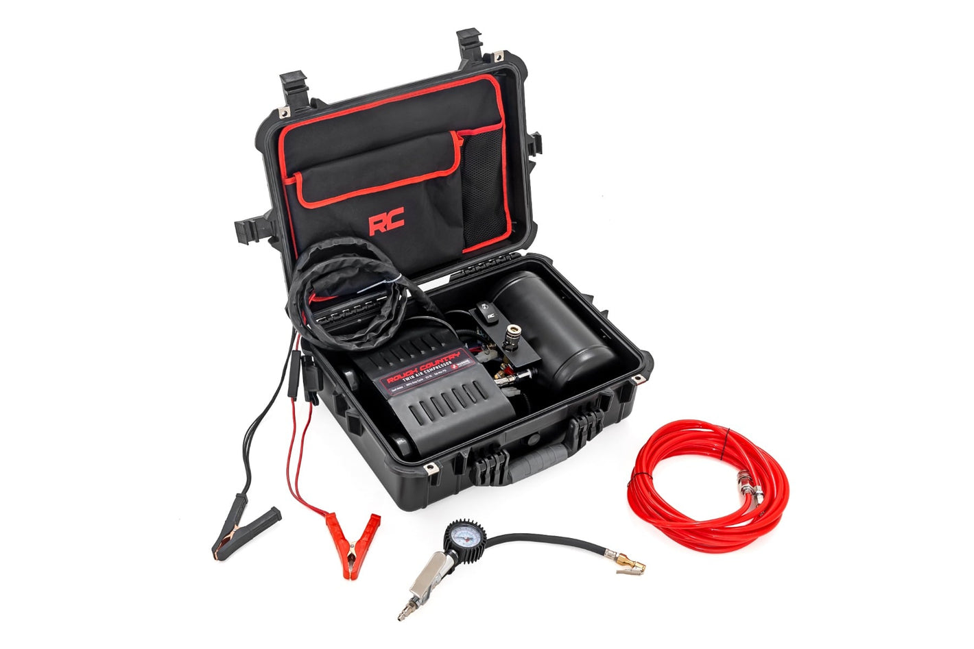 an open portable case with an air compressor and its components