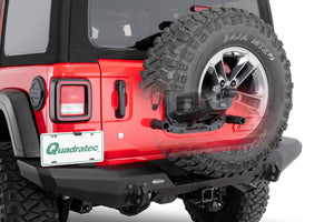 the rear of a red jeep with a partially transparent spare tire, revealing an installed bump stop