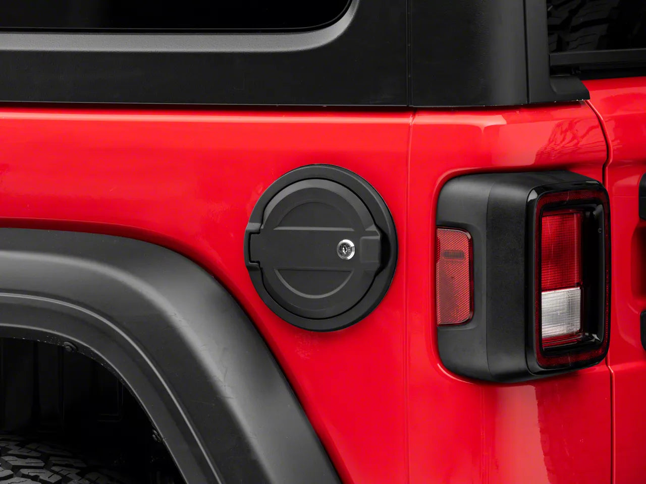 a close cropped image of a jeep wrangler with a fuel door cover installed
