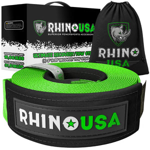 a neatly rolled, green tow strap sits in front of its packaging and draw string carrying bag