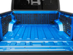 a blue truck bed with bed mounting system installed