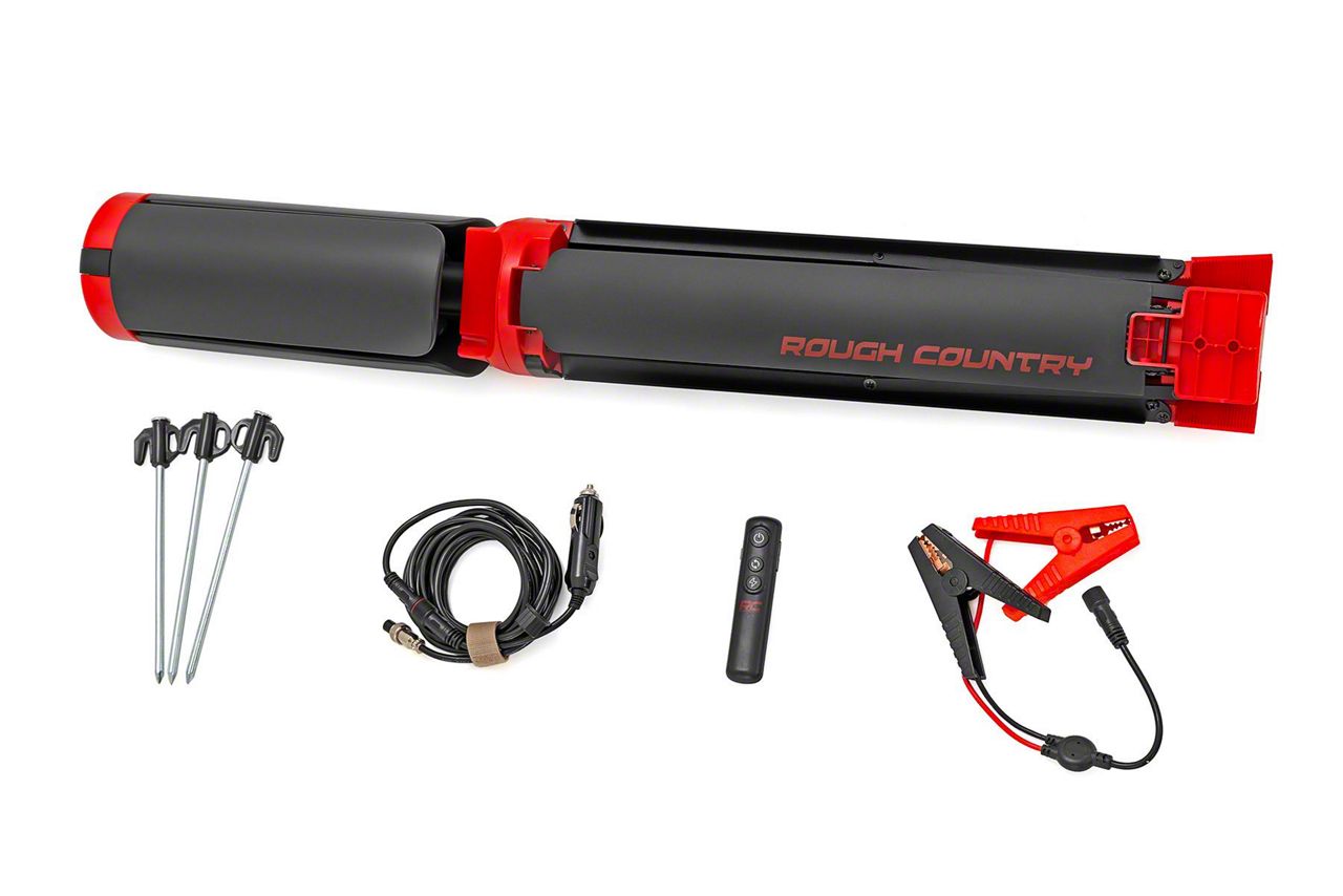 a folded red and black tripod displayed with its attachments