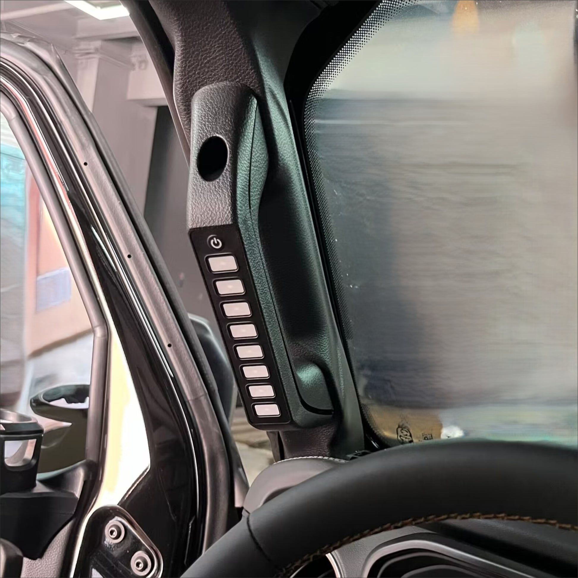 an 8 button panel installed in a vehicle’s grab handle